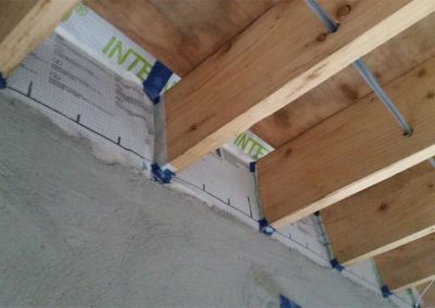 Air Tightness Testing & Thermal Imaging Meath SOLUTION - Use of air tightness membrane & tapes to stop drafts coming in around joists from outside via cavity